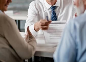 people signing papers